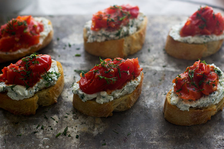 A delicious burst cherry tomato and herbed ricotta crostini recipe that will wow your guests. | Ideahacks.com