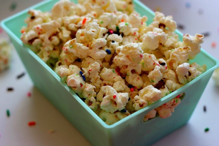 Filled with creamy white chocolate, yellow cake mix, and colorful sprinkles, you'll find a new reason to celebrate with this Cake Batter Popcorn. | Ideahacks.com