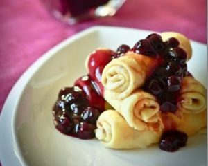Fresh Cheese filled Crepes with Blueberry Sauce