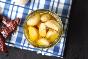 Garlic Confit - This recipe can be used to go on pizza, pasta, and mashed potatoes. It makes a great olive oil as well. | Ideahacks.com