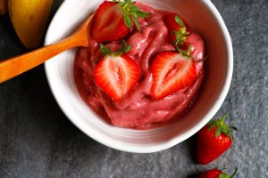 Strawberry Banana Ice Cream Recipe. Easy instant healthy Ice Cream made with only 2 ingredients - bananas and strawberries for a healthy summer treat. | Ideahacks.com