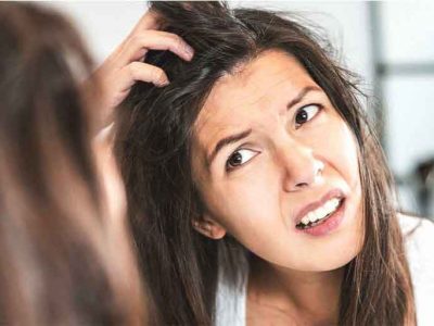 girl scratching her scalp