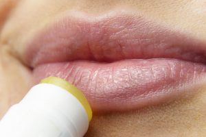 Applying Lip Stain on Girl's Lips