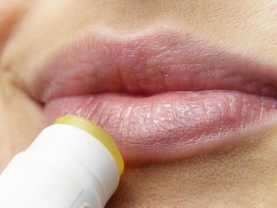 Applying Lip Stain on Girl's Lips