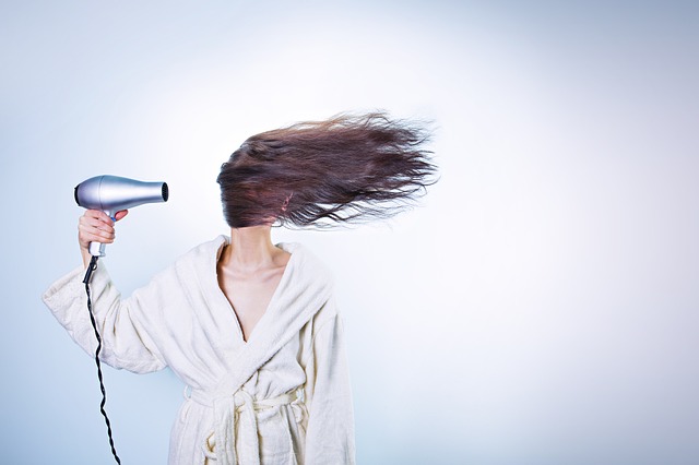 woman having a bad hair day because of damaged hair
