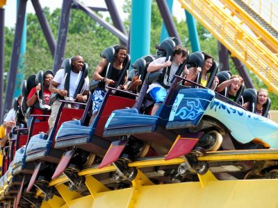 people riding on a roller coaster